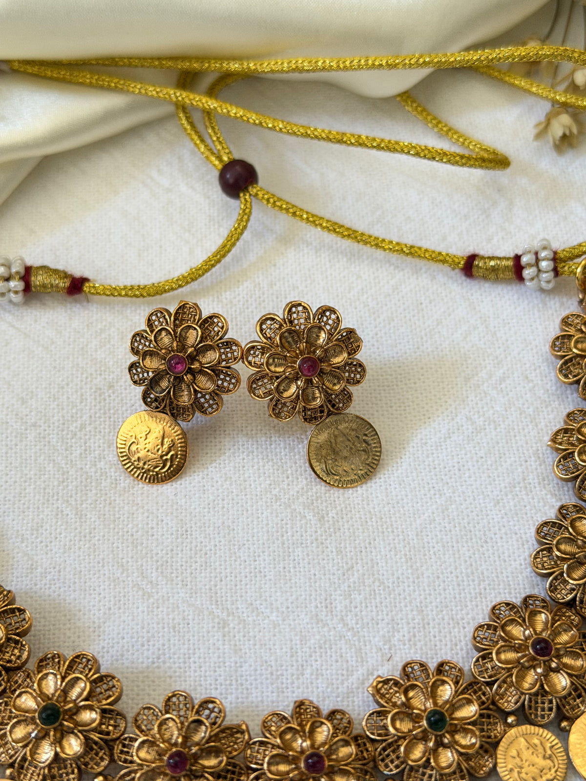 Varnika Antique Gold Floral Coin Necklace Set with Earrings